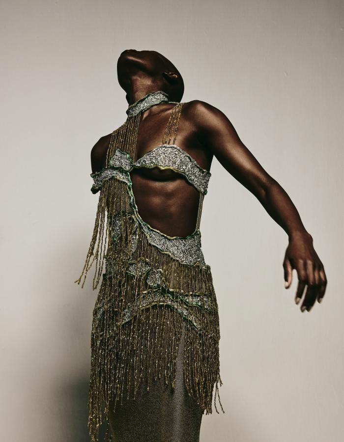 Photo by NOT JUST A LABEL on September 02, 2026. May be an image of one or more people, makeup, people dancing, headscarf, costume, headdress, fishnet stockings and text.